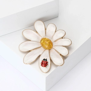 Enamel daisy brooch with red ladybug on white petals, fashion accessory for women
