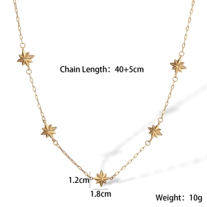 Detail view of gold chain necklace with layered star pendants and measurement specs