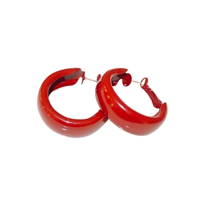 Glossy red C-shaped tubular hoop earrings with minimalist geometric metal design