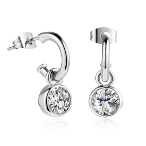 Elegant silver earrings with round clear zircon crystals on a reflective white surface