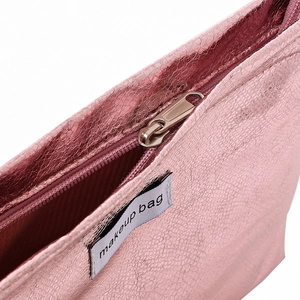 Pink metallic PU leather makeup bag with pleated texture and zipper closure
