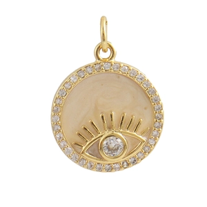 Detailed view of evil eye pendant with gold plating, beige enamel and white cubic zirconia