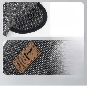 Detailed view of winter thermal cap with ear flaps and premium stitched leather logo patch