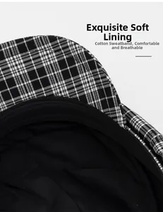 Detail of checkered newsboy cap showing soft cotton sweatband and black inner lining
