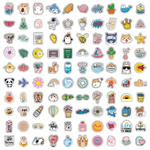 Flat lay of diverse waterproof PVC aesthetic stickers with cute cartoon and slogan designs