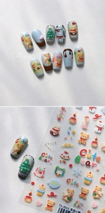 Detail of Christmas nail stickers featuring cartoon bears, trees and cute snowman motifs