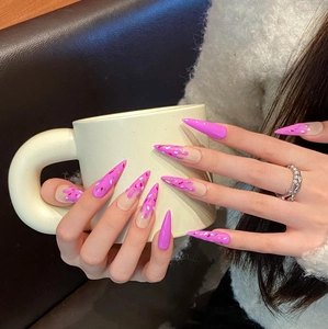 Handmade stiletto press-on nails with pink drip glaze and colorful candy sprinkle texture