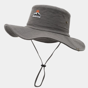 Detail view of grey hiking hat with embroidered logo, metal eyelets and adjustable chin cord