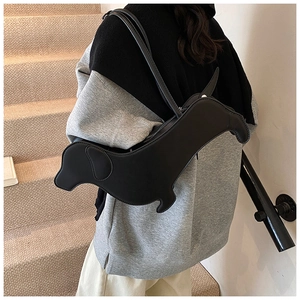 Detail of the dachshund dog shape creative black matte leather tote underarm bag