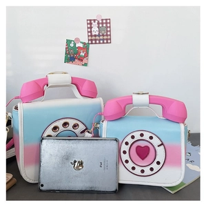 Creative gradient telephone shaped crossbody bags shown for size comparison next to an iPad