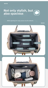 Detailed interior of large diaper bag showing waterproof layers and storage pockets