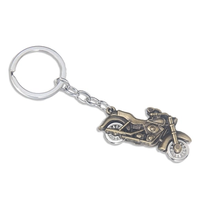 Vintage bronze motorcycle keychain with detailed metal bike pendant on white background