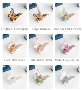 Detailed grid of acetate butterfly hair claws in nine colors including tortoise and floral prints
