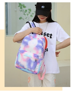 Detail of adjustable shoulder straps on star dye casual backpack with zip pocket