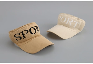 Detail of knitted visors with SPORT text showing elastic texture and beach sun visor brim