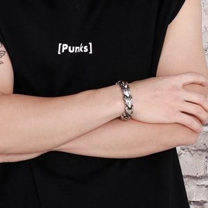 Detailed view of heavy punk style titanium steel bone chain bracelet on model wrist