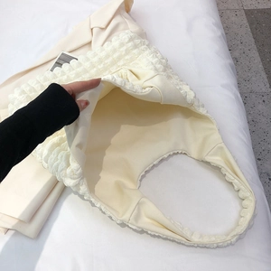 Creamy white puffy flower shoulder bag with bubble texture and minimalist fabric design