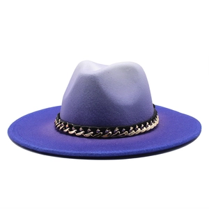 Detail of purple gradient wool felt fedora with decorative metal chain accent