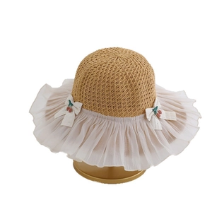 Kids straw sun hat with white chiffon brim and cherry bow accents for summer outdoor wear
