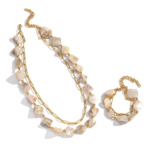 Gold double-layered necklace and bracelet set with irregular white shell beads