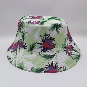 Detail of tropical leaf print and reinforced quilted brim on this reversible bucket hat