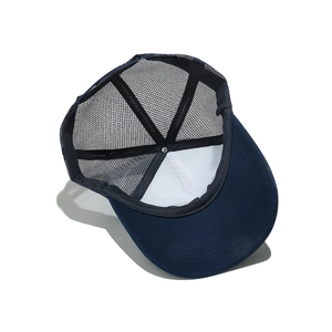 Detailed 45-degree angle view of deep blue mesh trucker hat with breathable structure
