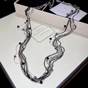 Elegant multilayered beaded necklace in black and silver style for chic women