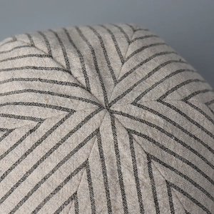 Detailed macro view of the pinstripe fabric and top stitching on this retro newsboy cap