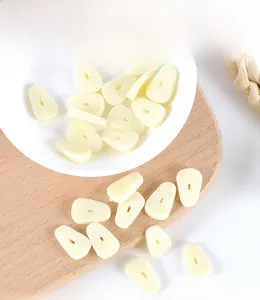 Macro detail of miniature PVC garlic slice models for dollhouse food DIY scenes