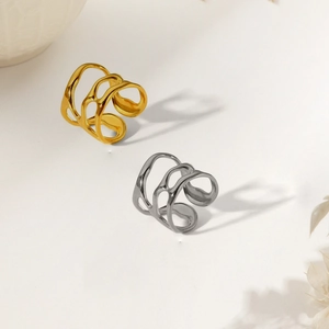 Polished stainless steel irregular hollow rings in gold and silver finish on white background