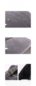 Detailed macro view of gray washed cotton baseball cap with adjustable metal buckle and stitching