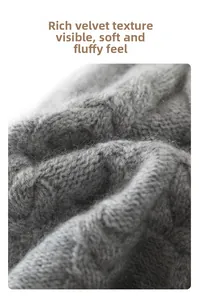 Macro shot of grey cable knit texture with soft fluffy surface on winter warm beanie