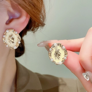 French vintage pearl stud earrings with gold relief butterfly and cream enamel finish