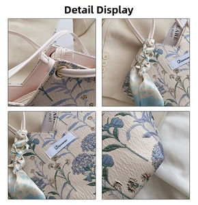 Close-up of floral embroidery on canvas tote with decorative scarf and handle details