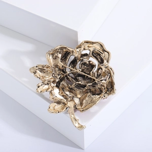 Detailed back view of the luxury gold rose brooch showing the secure safety pin fastener