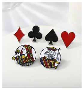 Detail view of a 6-piece poker suit enamel pin set featuring card suits and royalty icons