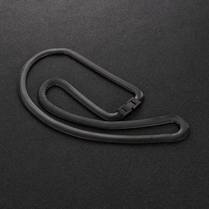 Close-up of black flat snake chain necklace with square buckle on dark textured surface
