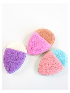 Close-up of thick teardrop face sponges in purple, pink and orange for deep cleaning