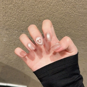 Pink champagne cat eye press-on nails with magnetic heart design in a medium-long square shape