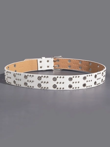 Detailed close-up of white leather punk belt featuring double row silver metal eyelets
