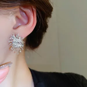 Sparkling starburst stud earrings with silver plating and cubic zirconia for women