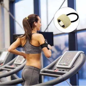 Detail of golden rhinestone ponytail cuff showing secure grip during gym exercise