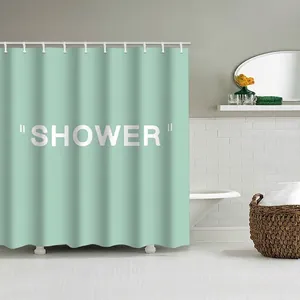Vue détaillée du rideau de douche imperméable vert menthe avec inscription SHOWER