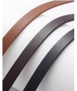 Detail showing the litchi texture of PU leather belts in brown, coffee, and black tones