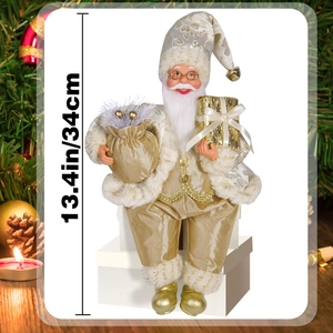 Detail of 13.4in champagne gold sitting Santa Claus doll in a festive holiday scene