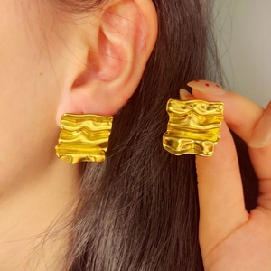 Vintage gold square earrings with irregular wavy texture and polished brushed finish