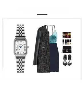 Detailed flat lay of silver square watch with steel band and matching fashion accessories