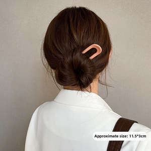 U-shaped hair fork in matte skin pink finish, sized 11.5x3cm for elegant bun styling