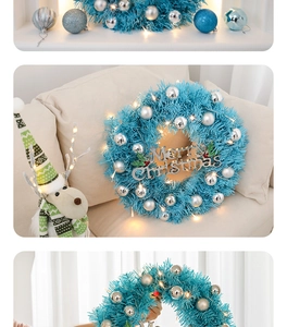 Close-up of blue Christmas wreath with warm LED lights and silver ornaments decor