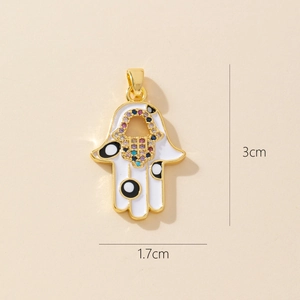 Hamsa Hand pendant detail with white enamel polka dots and colorful crystals on gold base